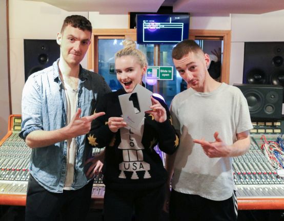 Clean Bandit pictured with their Official Number 1 Award for their single Rockabye [Credit: Official Charts.com]
