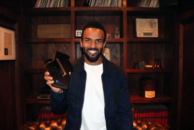 Craig David pictured with his Official Number 1 Award for Following My Intuition, his first Number 1 album in 16 years. [credit OfficialCharts.com]