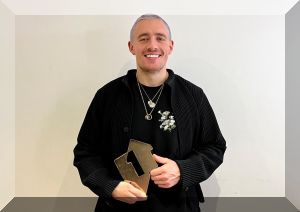 Dermot Kennedy poses with his Official Number 1 Award from the Official Charts Company for Sonder (credit: Official Charts Company)