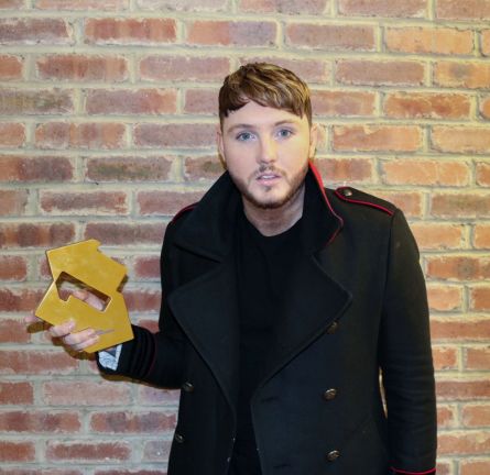 James Arthur pictured with his Official Number 1 Award for his Back From The Edge album [Credit: Official Charts]