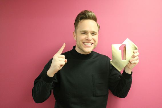 Olly Murs pictured with his Official Number 1 Award for his album 24 HRS [Credit: Official Charts.com]