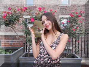 Olivia Rodrigo pictured with her Official Number 1 album award for GUTS (Credit: Official Charts)